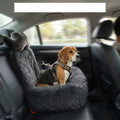 Dog resting comfortably in CradlePetss car mounted dog bed with safety harness clip attached to harness
